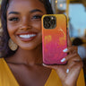 Women holding the Mermaid Sunset Tough Phone Case