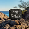 Mermaid Black insulated lunchbox and Ocean Blue tote bag on the beach
